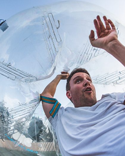 Player inside a bubble throwing his arms up